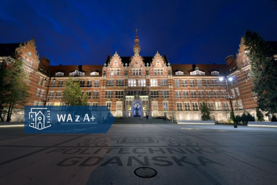 gmach główny PG wieczorem, na zdjęciu grafika: logo WAPG z A+