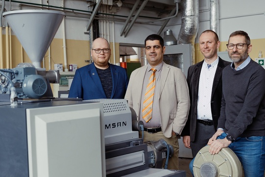 Reasarch team (from the left: Prof. Jacek Ryl, Prof. Mohammad Reza Saeb, Prof. Krzysztof Formela and Prof. Robert Bogdanowicz) at the planetary extruder used for preparation of polymer mixtures that can be used for 3D printing. Photo: Bartosz Bańka / Gdańsk University of Technology