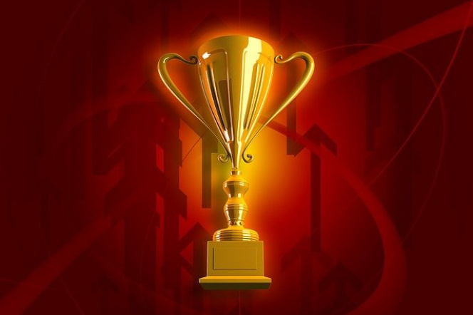 Gold cup on red background.