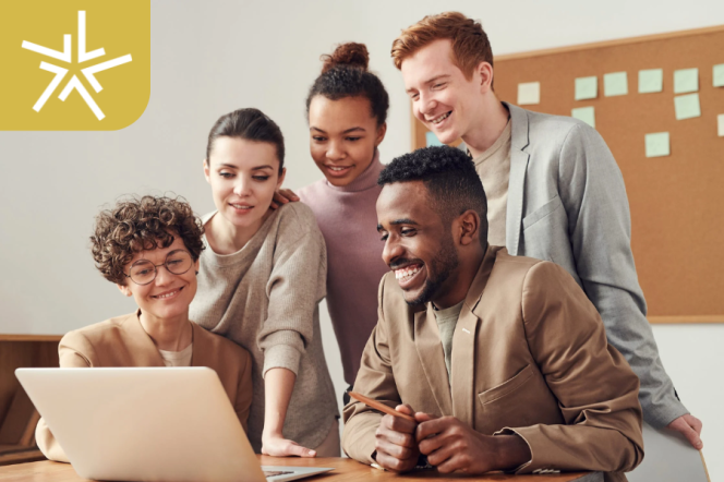 people smiling and working on thew computer