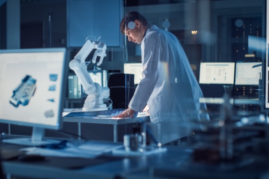 A scientist with the microscope 