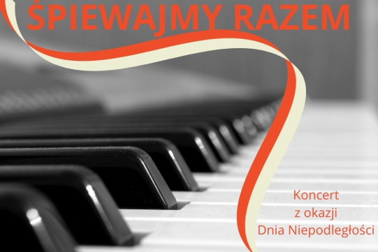 Klawiatura fortepianu z czerwono-białą wstążką 