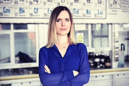 Pictured is Natalia Lukasik wearing a purple sweater.