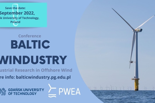 N zdjęciu, na niebieskim tle, po prawej stromnie widoczny jest wiatrak, po lewej stronie widoczna jest informacja o konferencji