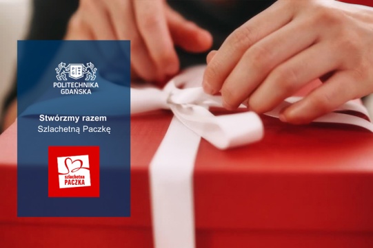 Dłonie na czerwonym pakunku z białą wstążką.