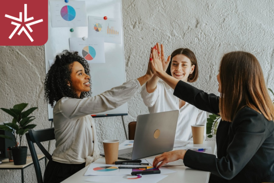 students sitting around the laptop