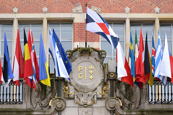 GUT banner and flags of countries on the main building