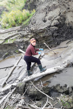 PhD Krystyna Kozioł is taking the sediment from the stream. Photo Małgorzata Szopińska