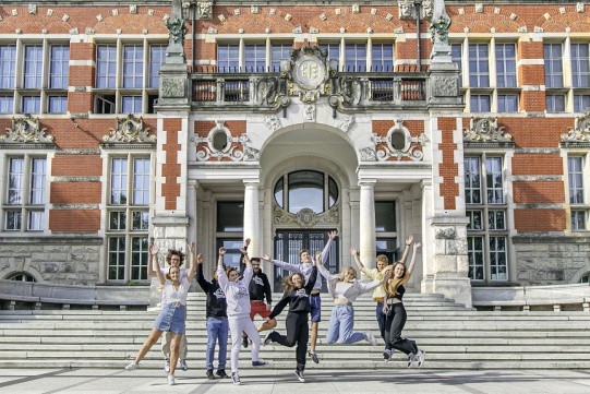 Jumping students on the front of Main Building